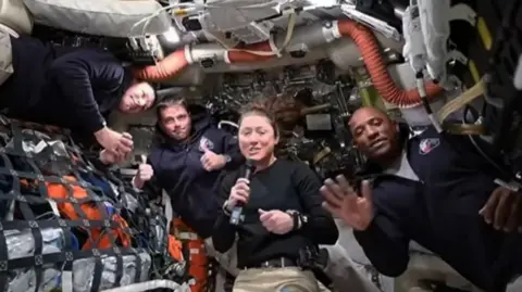 NASA Artemis II crew members Jeremy Hansen, Reid Wiseman, Christina Koch, and Victor Glover answer questions from reporters during the first downlink event of their mission April 2, 2026.