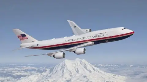 An artist rendering depicts the VC-25B in its new livery - with red, white, gold and dark blue paint scheme for Air Force One.