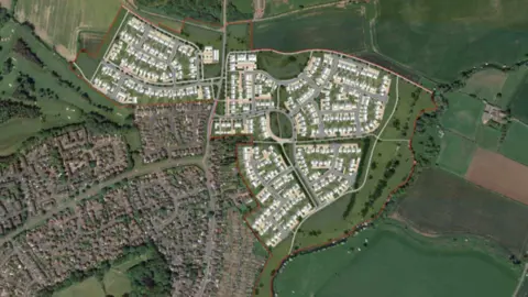 Skerningham Garden Village An overhead view of the proposed homes. Dozens of homes and new streets are superimposed on a field, north-east of an existing group of houses.