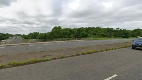 Google A bridge which had a concrete verge in the middle of its six lanes going over the M5 motorway.