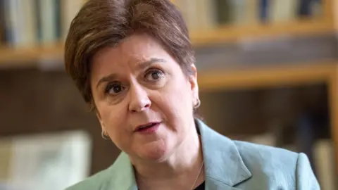 PA Media Nicola Sturgeon, who has short brown hair, in a close-up shot. 
