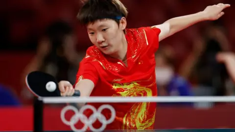 China's Wang Manyu in action during her women's team gold medal-winning match