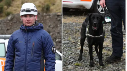PA Media A split image, one showing a man standing outside in a navy coat and white helmet in front of a car - the other showing a black dog on a lead also standing outside in front of a car.