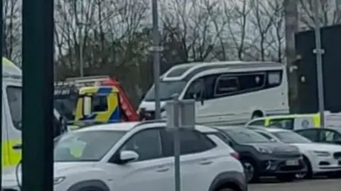 David Cardwell A white motorhome parked in a police compound