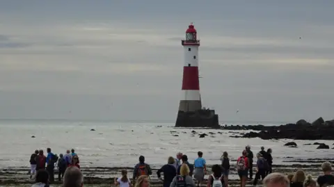 ROTARY CLUB OF EASTBOURNE Walkers during a previous lighthouse challenge