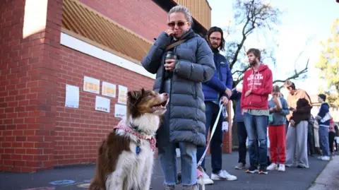 Voters stand in line in the Australian city of Melbourne 