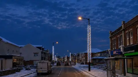Proposed columns of festive blue and white lights