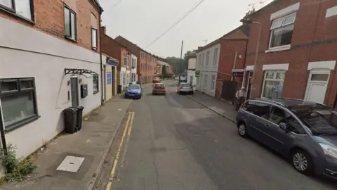 Urban street of two storey Victorian and more modern terraced houses