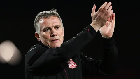 Wrexham manager Phil Parkinson applauds