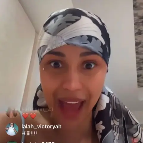 Cardi B / Instagram Cardi B talks to the camera while broadcasting live on Instagram