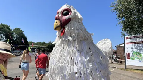 Clara-Mae Turrall/BBC  Giant chicken costume