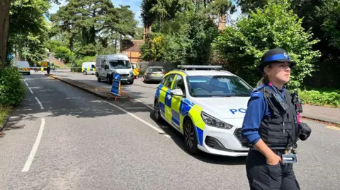 BBC  The Clifton Suspension Bridge with police cars in front of it