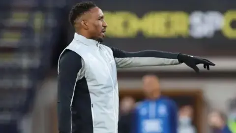 Getty Images Jermain Defoe in track suit pointing 