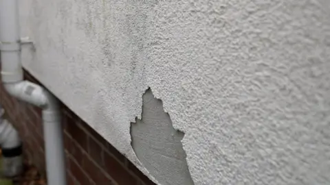 Scott Proudman Render is falling off Scott Proudman's home.