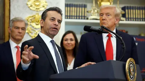 Commissioner of Food and Drug Administration Marty Makary delivers remarks alongside, U.S. President Donald Trump, Administrator for the Centers for Medicare & Medicaid Services Mehmet Oz and Sen. Katie Britt (R-AL), during an event in the Oval Office of the White House on October 16, 2025 in Washington, DC. 
