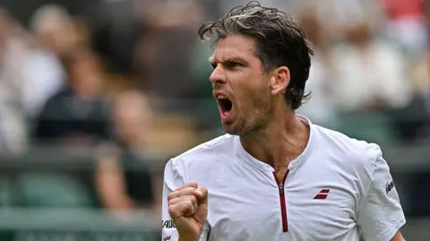 Cameron Norrie celebrates his win