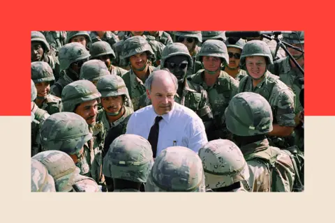 AP Dick Cheney surrounded by soldiers