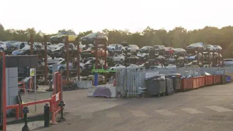 A1 Group's scrapyard in Barkham - hundreds of scrap cars can be seen. 