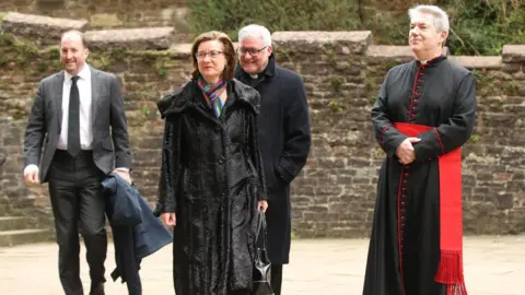 Athena Picture Agency Eluned Morgan, who is wearing a black jacket and a multi-coloured scarf