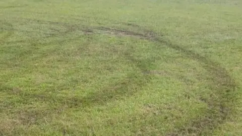 LDRS Grass with tyre marks from illegal off-road bikes on sports pitches.
