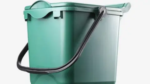 Coventry City Council A green food waste caddy with a black handle