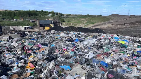 BBC A mountain of rubbish on a landfill site in Glasgow