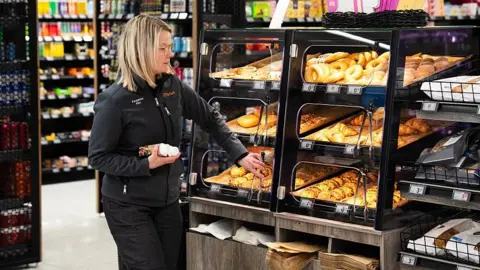 A worker in a Finnish supermarket