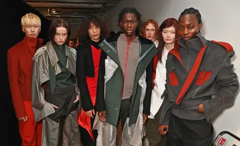 Dave Benett/Getty Images Models pose backstage at the Central Saint Martins MA Fashion show during London Fashion Week February 2025 on February 20, 2025 in London, England. 