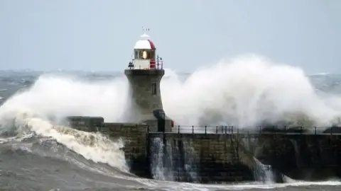 PA Media/Owen Humphreys Image of South Shields Lighthouse and pier before it was damaged