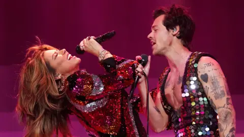 Getty Shania Twain and Harry Styles performing on stage at Coachella