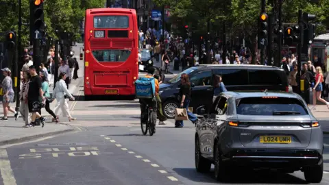 PA Media A view of Oxford Street in central London shows cars, bicycles and back of 139 bus