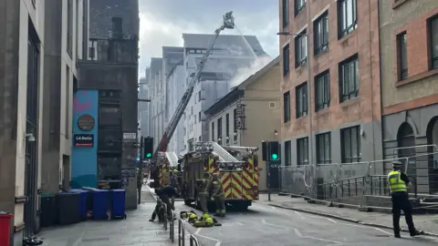 BBC Fire crews extinguishing a fire at OX184 in the Cowgate area of Edinburgh.