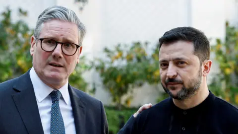 Prime Minister Sir Keir Starmer (left) and President of Ukraine Volodymyr Zelensky speak to the media at the UK Ambassador's Residence in Paris, after a meeting with European leaders to discuss peace and security for Ukraine.