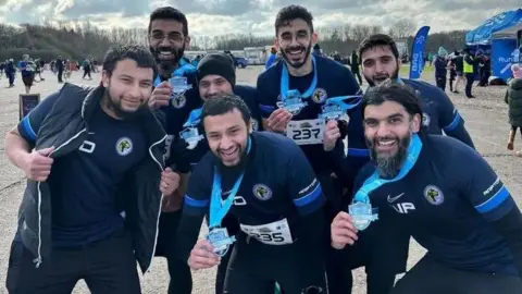Bilal Dalvi Road Raptors running group after marathon