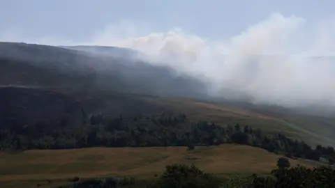 Reuters Smoke from a moorland fire rises near the Dovestone Reservoir in Manchester.