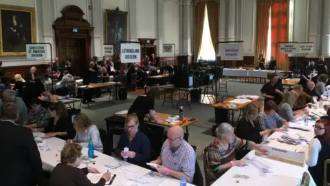 Andrew Turner/BBC Council staff counting votes after an election