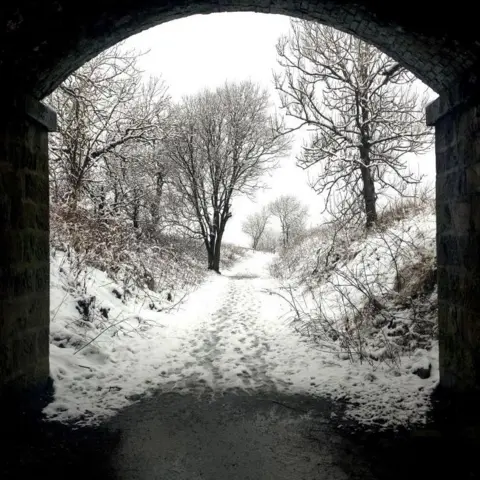 Craig Walker Snowy scene through an arch