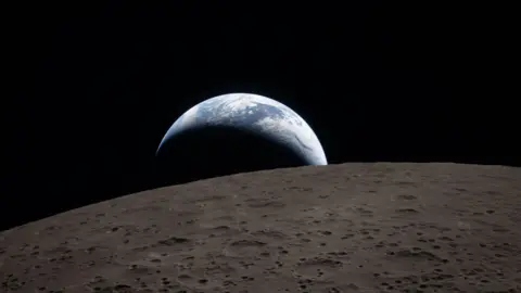 NASA Earthset captured through the Orion spacecraft window at 6:41 p.m. EDT, April 6, 2026, during the Artemis II crew’s flyby of the Moon. A muted blue Earth with bright white clouds sets behind the cratered lunar surface. The dark portion of Earth is experiencing nighttime. On Earth’s day side, swirling clouds are visible over the Australia and Oceania region. In the foreground, Ohm crater has terraced edges and a flat floor interrupted by central peaks. Central peaks form in complex craters when the lunar surface, liquefied on impact, splashes upwards during the crater’s formation.