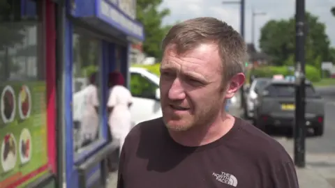 Mark Taylor in a street in Harpurhey