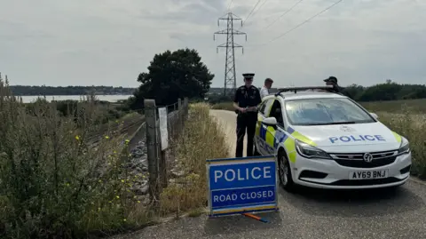 George King/BBC Police car on a track in Brantham