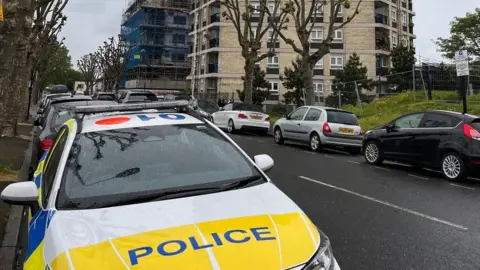 Police car at block of flats on New City Road