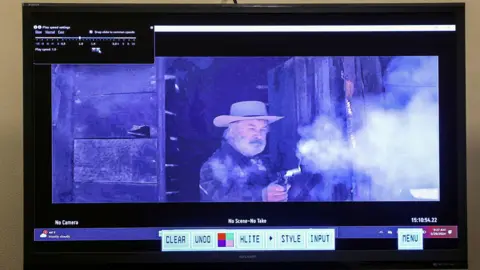 Reuters A still from a video clip shows actor Alec Baldwin firing a weapon on the Rust film set during armorer Hannah Gutierrez-Reed's involuntary manslaughter trial