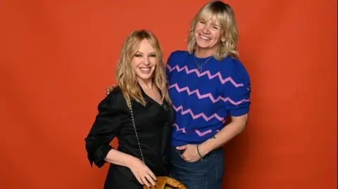 Zoe Ball and Kylie Minogue posing for a photograph when the singer came on the Radio 2 Breakfast show.