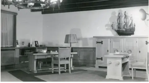 Museum of Resistance and Deportation of Besancon The desk of an SS Comandant of Buchenwald shows a number of things on it, including the lampshade.