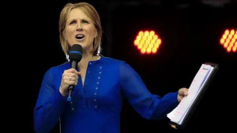 Getty Images Presenter Katharine Merry greets the spectators during the Muller Indoor Grand Prix 2017.