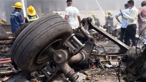 Debris at the site of a plane crash near Sardar Vallabhbhai Patel International Airport in Ahmedabad, Gujarat, western India, 12 June 2025. 