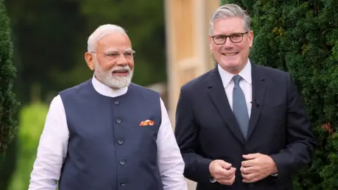 Prime Minister Sir Keir Starmer (right) with the Prime Minister of India, Narendra Modi, walk in the grounds during his visit to Chequers, the country house of the serving Prime Minister of the UK, near Aylesbury in Buckinghamshire. Picture date: Thursday July 24, 2025. PA Photo.