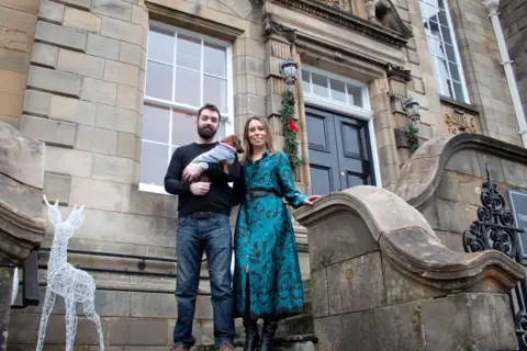 Kiirsty Anderson Hannah and Gordon outside their home