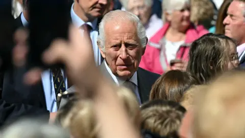 Reuters King Charles surrounded by crowds ahead of meeting members of the local community in Southport after the knife attack on 29 July