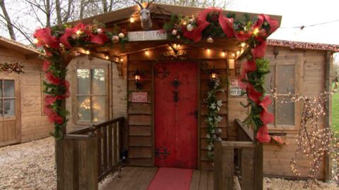 A Christmas grotto decorated with Christmas decorations